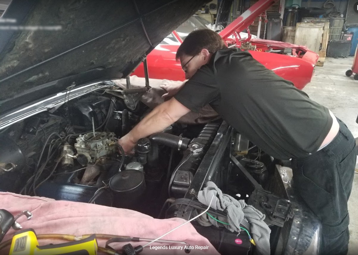 Danny Smith working under the hood at Legends Luxury Auto Repair in Tempe, Arizona