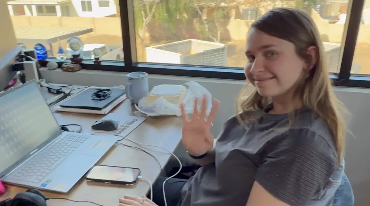 Karen at her editing workstation producing video content